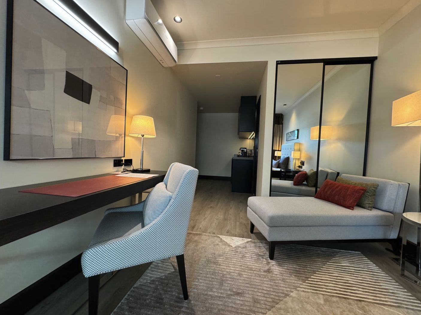 Furnished Harmony suite with a desk, reading lamp and chaise lounge